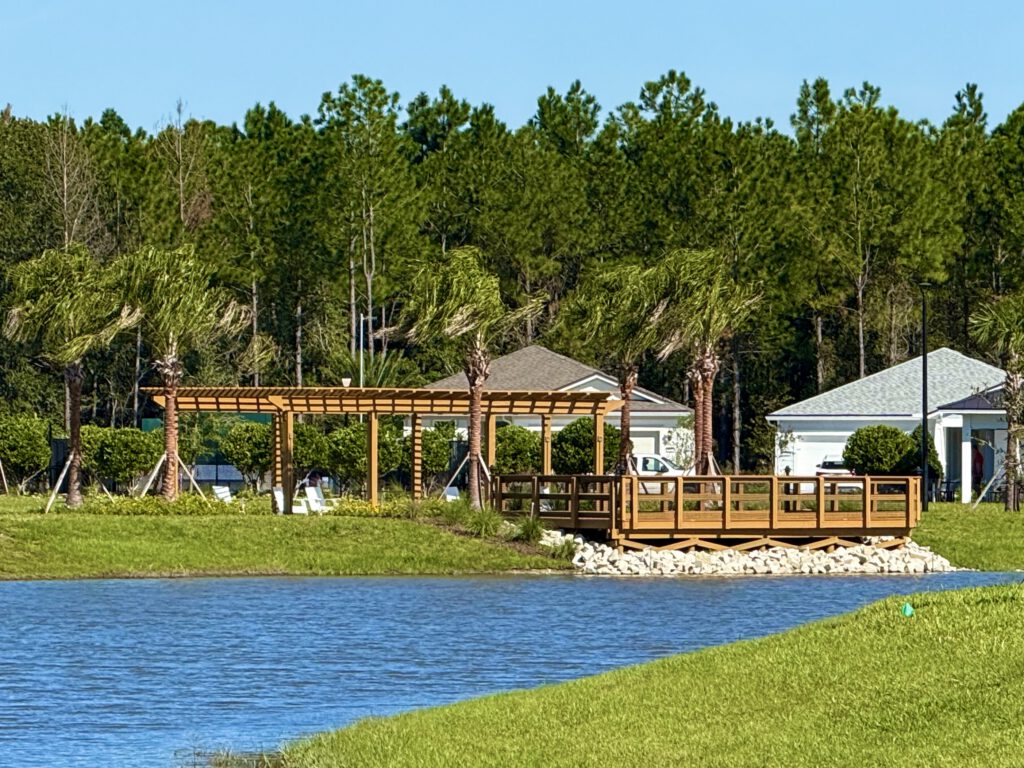 Wooden dock and pergola on a community pond