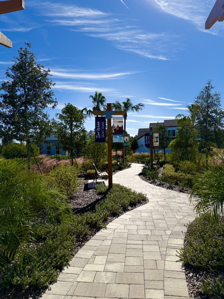 Paver walking path through landscaping at Del Webb Saint Johns