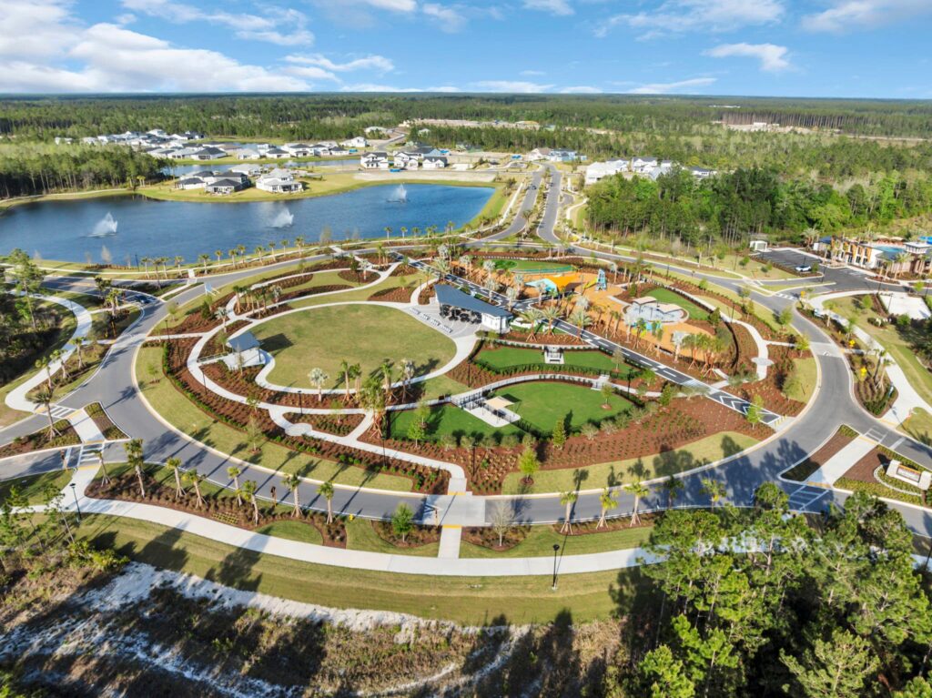 Aerial view of the Skipping Stone community park with lake, lawn and walking paths
