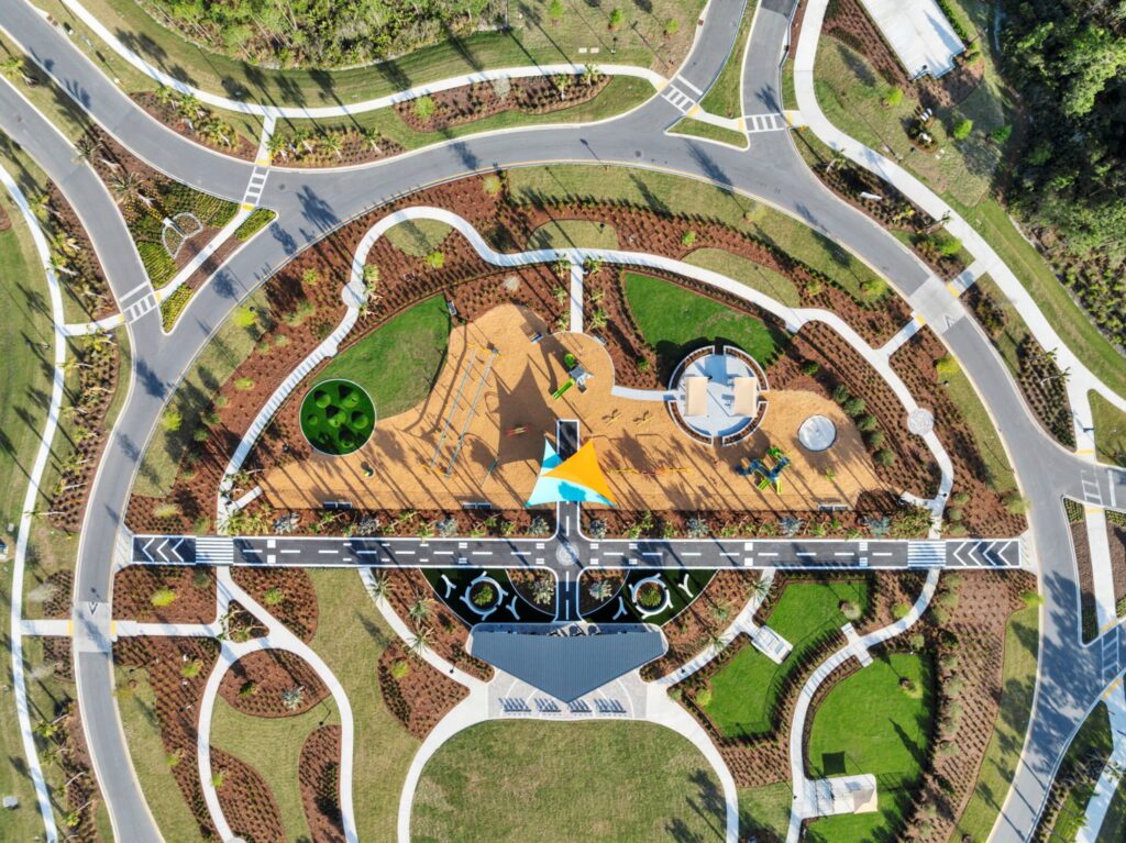 Overhead aerial view of the Skipping Stone community park, playground and walking paths