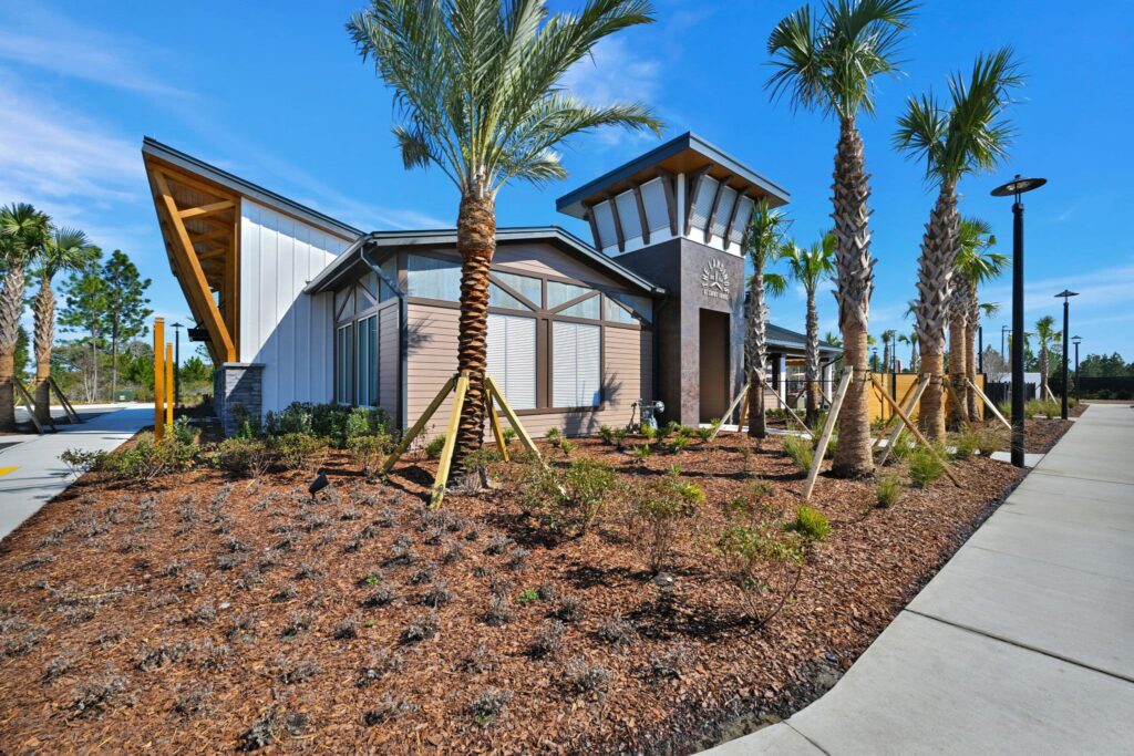 Amenity center exterior with palm landscaping at The Landings at St Johns