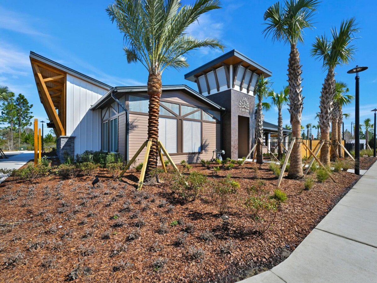 Amenity center exterior with palm landscaping at The Landings at St Johns
