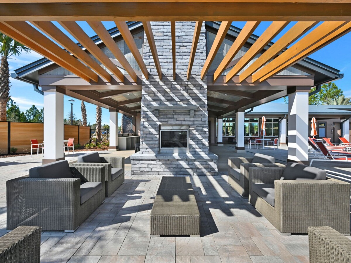 Outdoor fireplace and pergola seating at The Landings at St Johns
